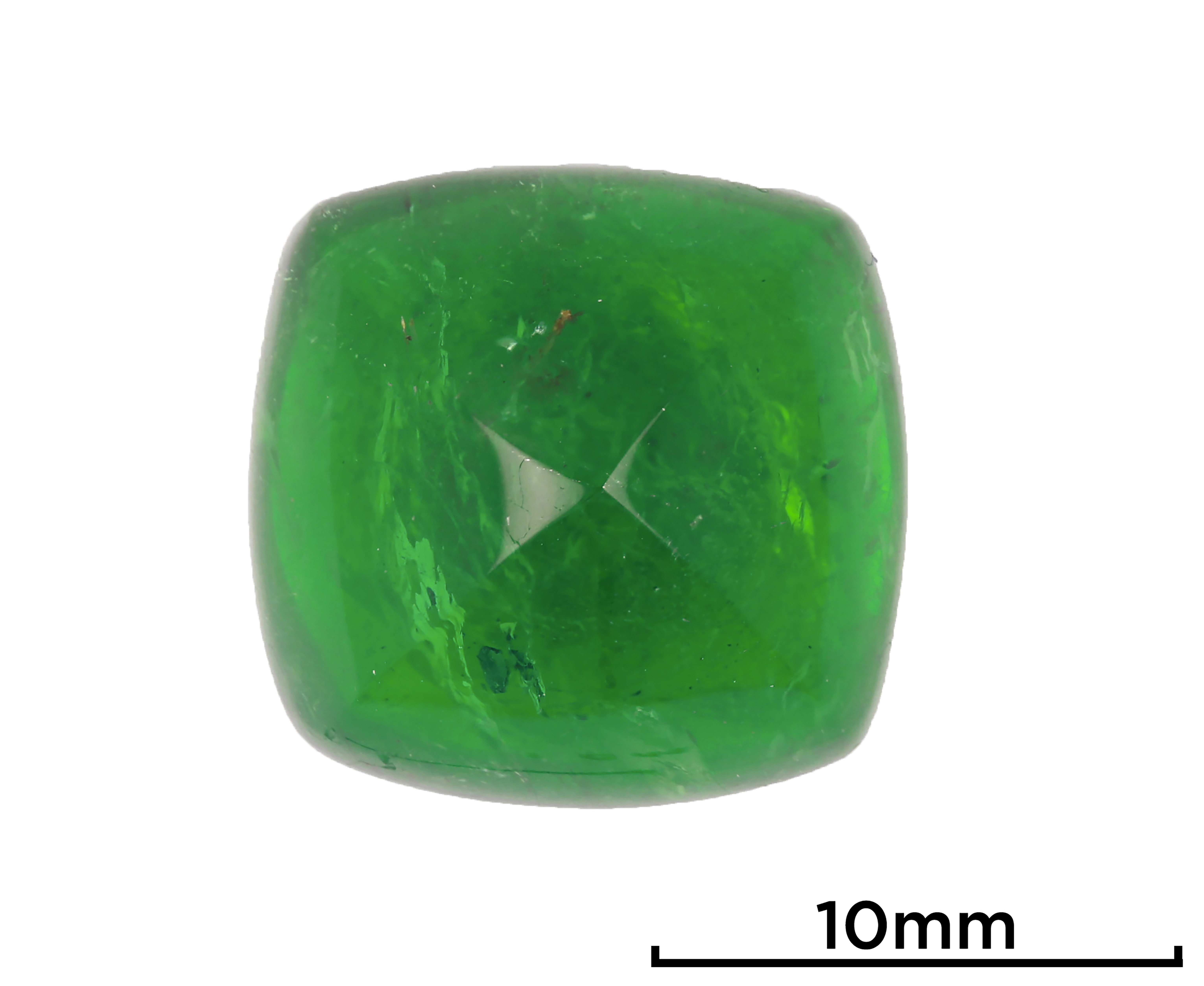 Figure 1.This sugarloaf-shape 10.48 ct Zambian emerald shows a vivid and highly saturated green color. Photo by Yisi Zhao.jpg